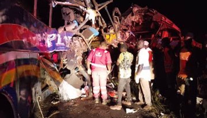 Wreckage of the collapsed buses seen as rescue workers try to recover injured and dead from the debris. — X@CapitalFMUganda