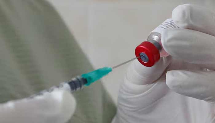 A nurse fills a syringe with a vaccine before administering an injection at a kids clinic in Kiev, Ukraine August 14, 2019. — Reuters