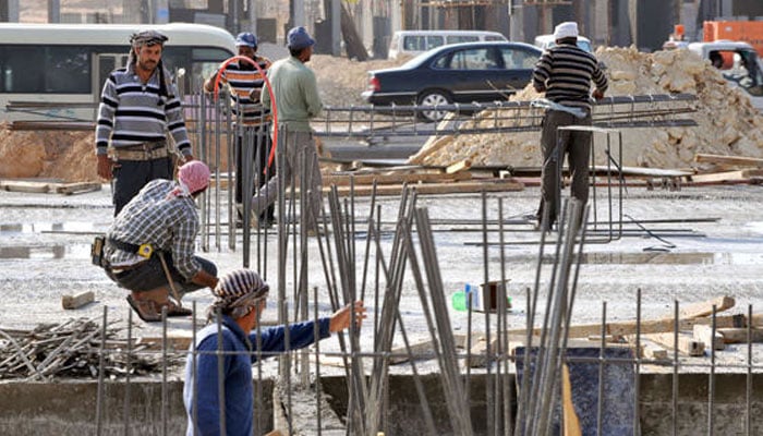 Laborers work at a construction site in the Saudi capital Riyadh. — AFP/File