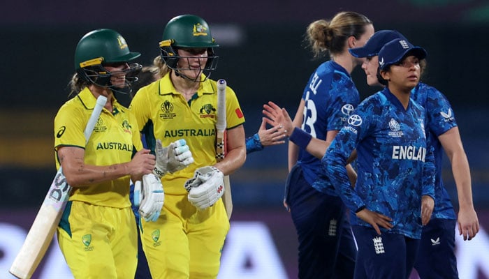 Australias Annabel Sutherland and Ashleigh Gardner celebrate after winning the match against England at Holkar Cricket Stadium, Indore, India on October 22, 2025. — Reuters