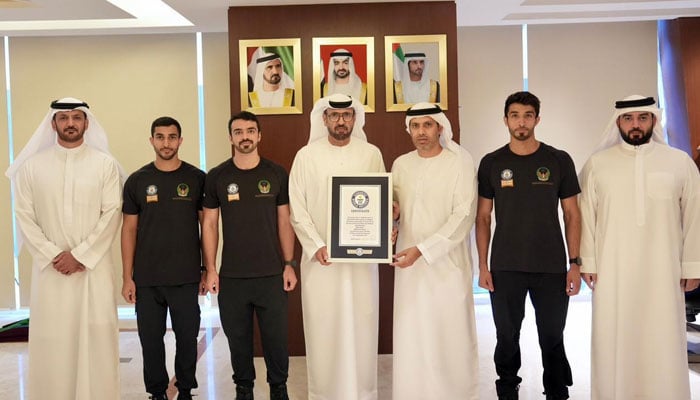 The Dubai Civil Defence firefighters receive the Guinness World Record certificate after completing the fastest climb of Burj Khalifa. — Dubai Civil Defence/File