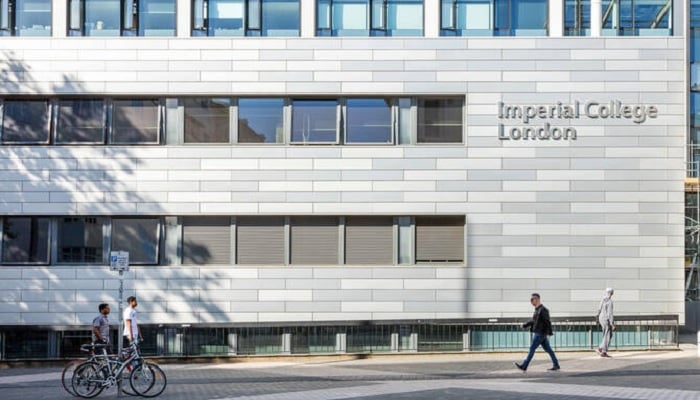 Pedestrians pass by the main building of Imperial College London. — Imperial College London