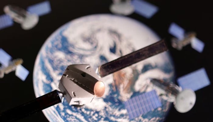 A satellite model is placed on a picture of Earth in this illustration taken November 25, 2024. — Reuters