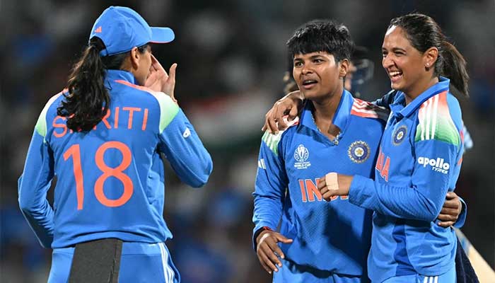 (Left to right) Indias Smriti Mandhana, Kranti Gaud, and Harmanpreet Kaur celebrate a wicket during the ICC Womens World Cup 2025 match against New Zealand at DY Patil Stadium, Navi Mumbai, on October 23, 2025. — AFP