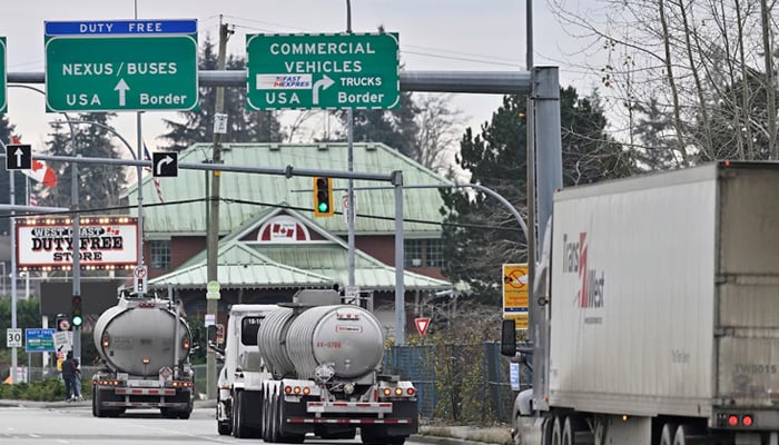 Commercial trucks head towards the U.S. Customs and Border Protection (CBP) Pacific Highway Port of Entry from south Surrey, British Columbia, Canada, November 26, 2024. — Reuters