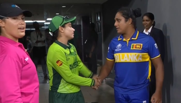 Pakistans Fatima Sana and Sri Lankas Chamari Athapaththu shake hands after their game is called off at the R Premadasa Stadium, Colombo, October 24, 2025. — ICC