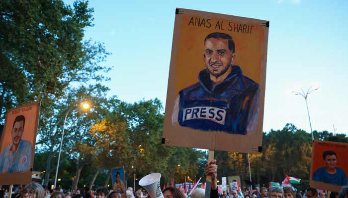 protesters display a memorial sign of slain Palestinian Al Jazeera journalist Anas al-Sharif during a demonstration called by Spanish unions in solidarity with Palestinians in Gaza, in Madrid, Spain, October 15, 2025.— Reuters