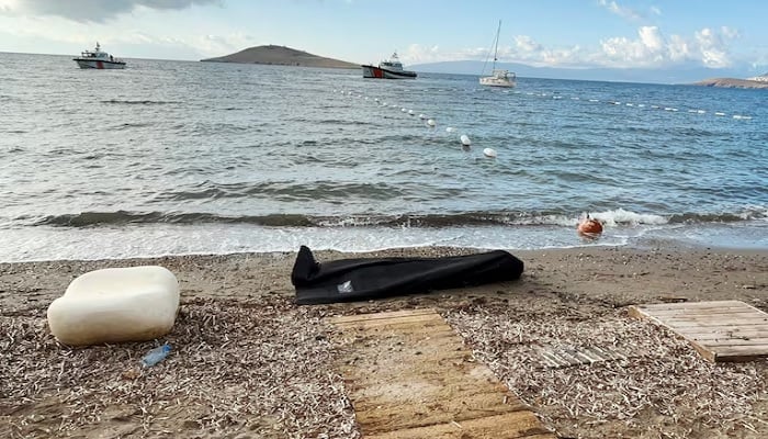 A body bag lies on the shore as Coast Guard Command members conduct a search and rescue operation following the sinking of a migrant boat off Bodrum, western Mugla province, Turkey, October 24, 2025.— Reuters
