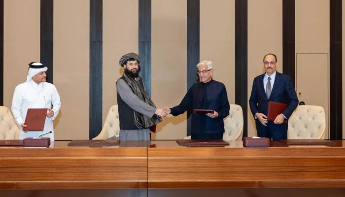 Defence Minister Khawaja Asif shakes hands with his Afghan counterpart Mullah Yaqoob after reaching a ceasefire deal with the Taliban authorities in Doha, Qatar, on October 18, 2025. — X@KhawajaMAsif