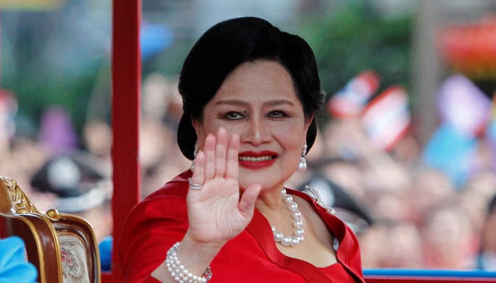 Thailands Queen Sirikit (late) waves to people during her arrival in Chinatown for Lunar New Year celebrations in Bangkok on January 23, 2012. — Reuters