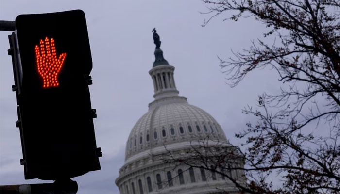 A Do not cross sign is illuminated at a crosswalk outside of US Capitol building in Washington, US, November 10, 2024. — Reuters
