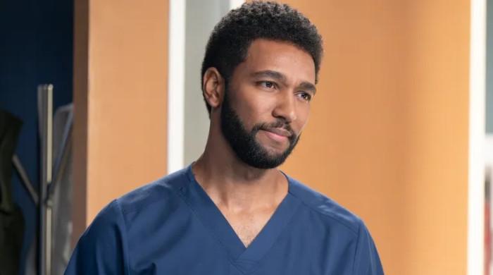 Anthony Hill and Ellen Pompeo on Grey's Anatomy set