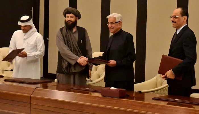 Defence Minister Khawaja Asif shakes hands with his Afghan counterpart Mullah Yaqoob after reaching a ceasefire deal with the Taliban authorities in Doha, Qatar, on October 19, 2025. — X@KhawajaMAsif