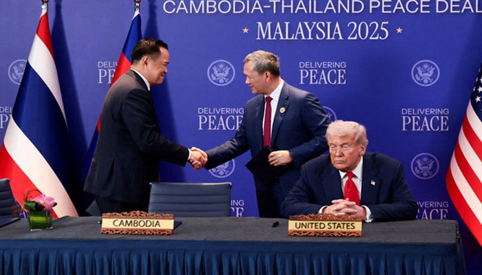 Thailands Prime Minister Anutin Charnvirakul and Cambodia’s Prime Minister Hun Manet shake hands next to US President Donald Trump, on the day of the signing of a ceasefire deal between Cambodia and Thailand on the sidelines of the 47th Association of Southeast Asian Nations (ASEAN) summit in Kuala Lumpur, Malaysia, October 26, 2025. — Reuters