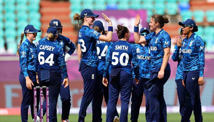 Englands Nat Sciver-Brunt celebrates with teammates after taking the lbw wicket of New Zealands Rosemary inCricket Stadium, Visakhapatnam, India on October 26, 2025. — Reuters