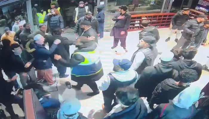 A brawl erupts at mosque in Hounslow, West London, England. — Screengrab via CCTV footage