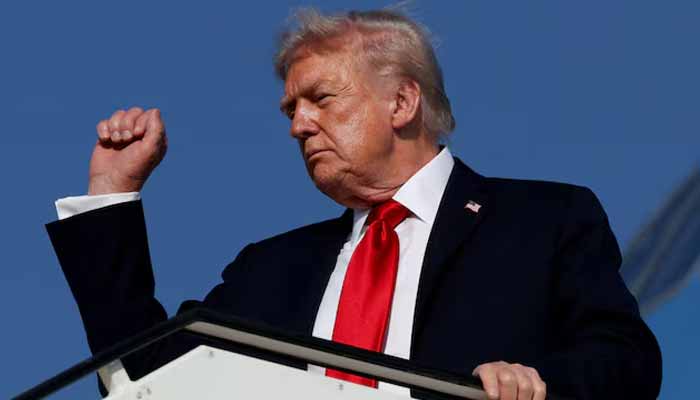 US President Donald Trump gestures as he boards Air Force One en route to Sharm El-Sheikh, Egypt, to attend a world leaders summit on ending the Gaza war on October 13, 2025. — Reuters