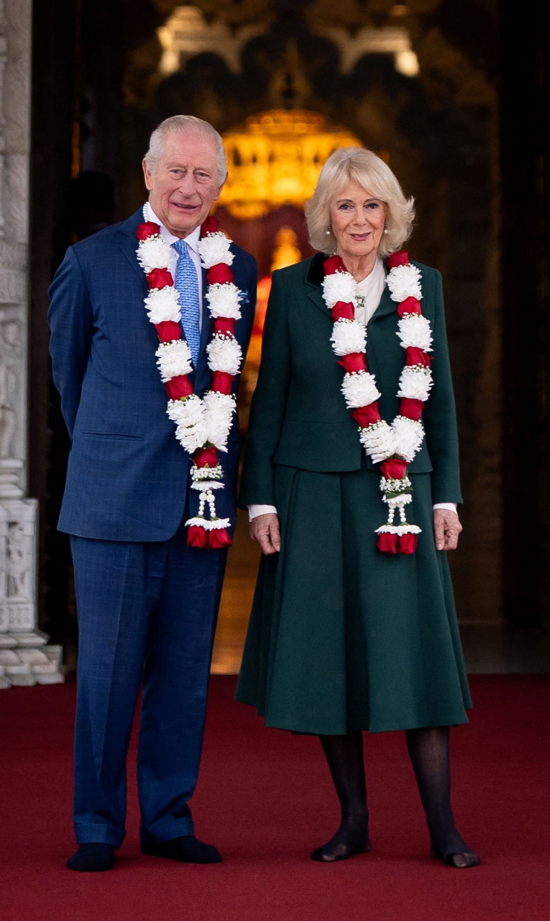 Britains King Charles III and Queen Camilla pose for a photo, as they arrive for a visit to BAPS Shri Swaminarayan Mandir (known as the Neasden Temple) in Neasden, London, Britain October 29, 2025. Aaron Chown/Pool via REUTERS