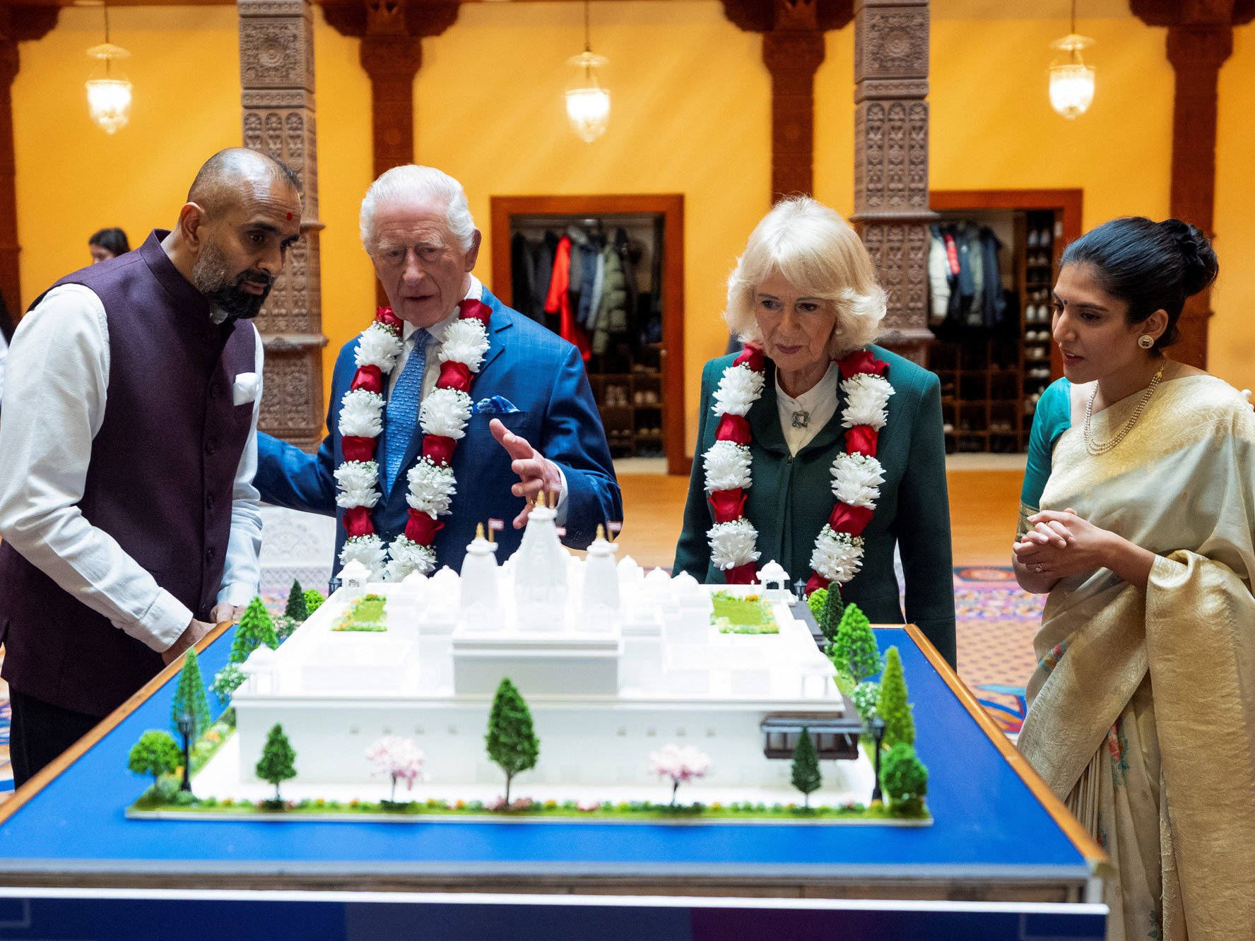 Britains King Charles III and Queen Camilla view a model of a new temple to be built in Paris, during a visit to BAPS Shri Swaminarayan Mandir (known as the Neasden Temple) in Neasden, London, Britain October 29, 2025. Aaron Chown/Pool via REUTERS