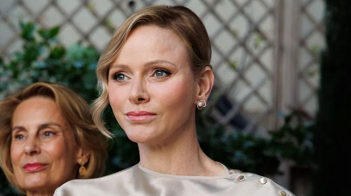 Princess Charlene of Monaco celebrates with young rugby players in Georgia