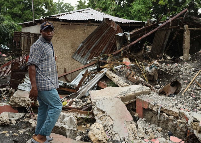 Jules Marcelin, who says he had two family members die in deadly flooding caused by Hurricane Melissa, shows the damage to his home, in Petit Goave, Haiti, October 30, 2025. — Reuters