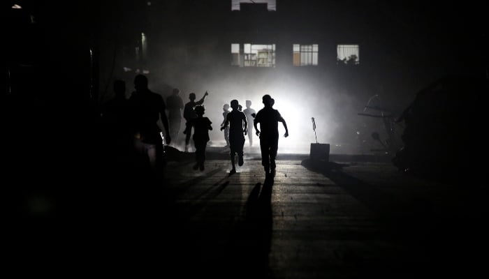 Palestinian children play in Khan Yunis, in the southern Gaza Strip on October 25, 2025. — AFP