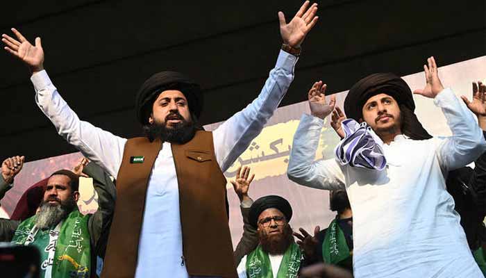 Tehreek-e-Labbaik Pakistan (TLP) leader Saad Rizvi (left) gestures to supporters during a protest in Lahore on February 10, 2024. — AFP