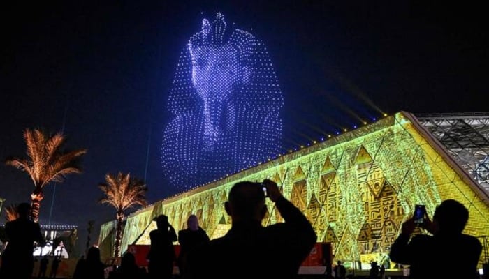 A drone light show depicts ancient Pharaoh King Tutankhamens sarcophagus during the opening ceremony of the Grand Egyptian Museum (GEM), near the Giza pyramid complex, in Giza, Egypt, November 1, 2025. — Reuters