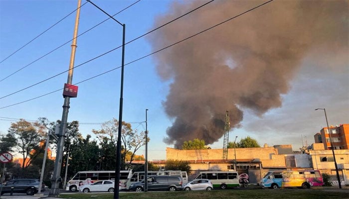 Smoke from a fire rises out of a shoe warehouse near Zocalo in Mexico City, Mexico November 16, 2023. — Reuters