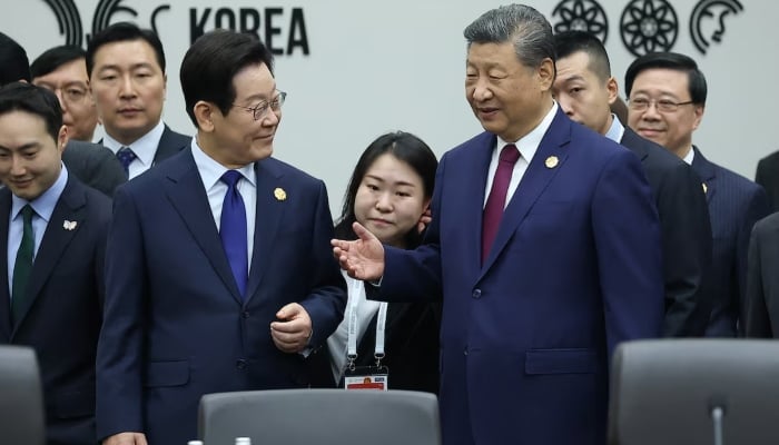 Chinas President Xi Jinping talks with South Koreas President Lee Jae Myung during the Asia-Pacific Economic Cooperation (APEC) summit in Gyeongju, South Korea, October 31, 2025. — Reuters