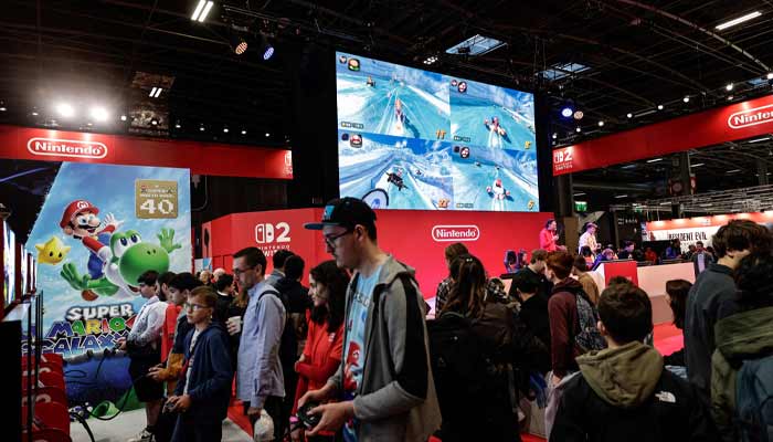 Visitors play Mario Kart at the Nintendo area during the Paris Games Week fair in Paris, on October 30, 2025.— AFP