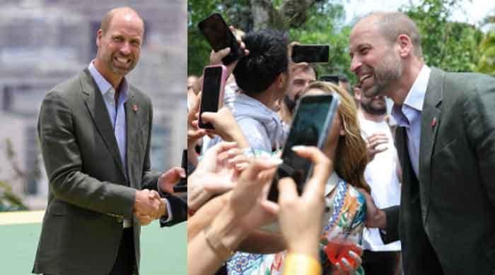 Prince William mingles with Brazilians after straightening Andrew up