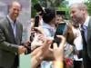 Prince William mingles with Brazilians after straightening Andrew up