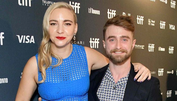 Daniel Radcliffe beams with pride as Erin Darke performs in Brodaway play
