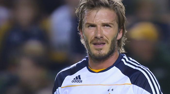 David Beckham pays tribute to wife Victoria as he gets knighthood