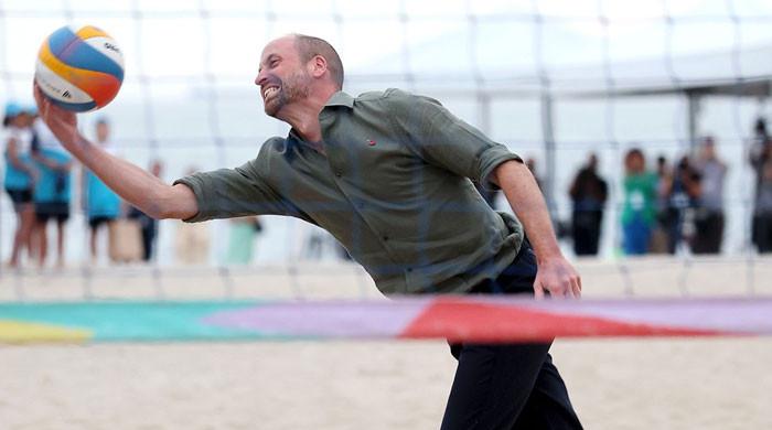 Prince William plays volleyball on Copacabana Beach