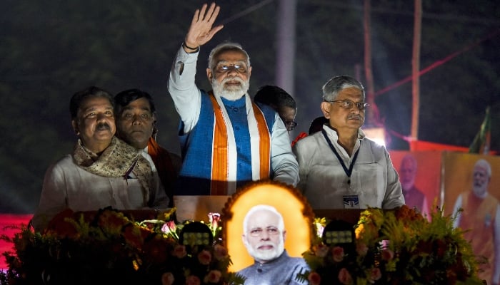 Narendra Modi, Indias Prime Minister and leader of the Bharatiya Janata Party (BJP), waves to supporters during his roadshow in Patna, ahead of assembly elections in Indias Bihar state on November 2, 2025. — AFP