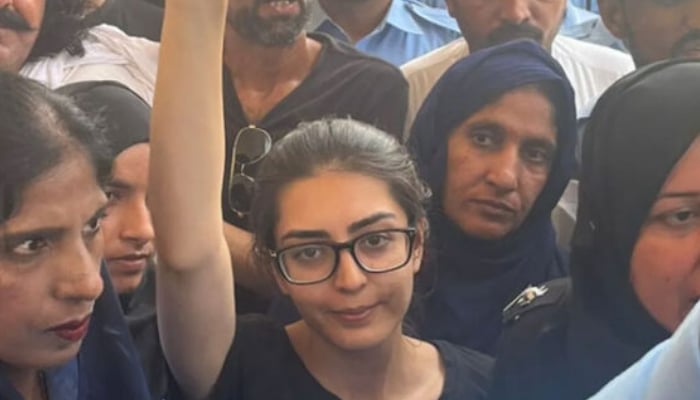 Lawyer and activist Imaan Mazar gestures before she is presented before a court in Islamabad in this undated picture. — APP/File
