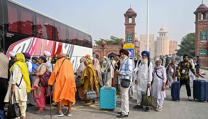 Indian Sikh pilgrims arrive in Pakistan after crossing the India-Pakistan Wagah border in Wagah on November 4, 2025, on the eve of celebrations marking the birth anniversary of Guru Nanak, founder of Sikhism. — AFP