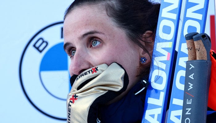 Frances Julia Simon reacts on the podium after winning the Womens 15km Individual on February 18, 2025. — Reuters