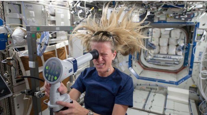 NASA astronaut in space with Earth in background