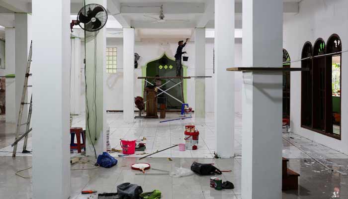 Workers work inside a mosque where explosions occurred the previous day, at a school complex in Jakarta, Indonesia, November 8, 2025.— Reuters