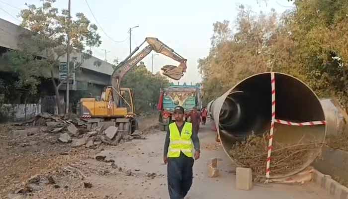 Work underway at Karachis University Road. — Reporter