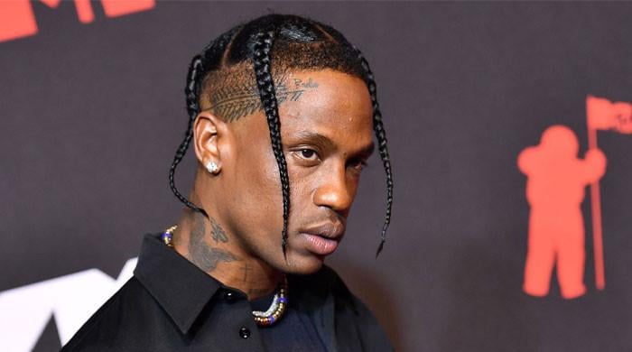 Travis Scott brings daughter Stormi onstage during Tokyo concert