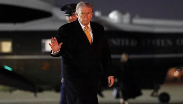 US President Donald Trump waves as he walks to board Air Force One while departing for Florida from Joint Base Andrews in Maryland, US, November 7, 2025.