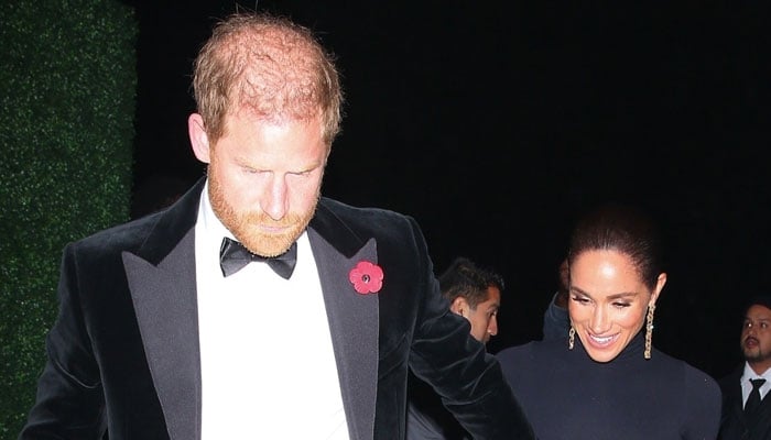 Prince Harry takes on bodyguard role for Meghan at Beverly Hills event