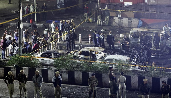 Police officers and forensic technicians work at the site of an explosion in the old quarters of Delhi, India, November 10, 2025. — Reuters