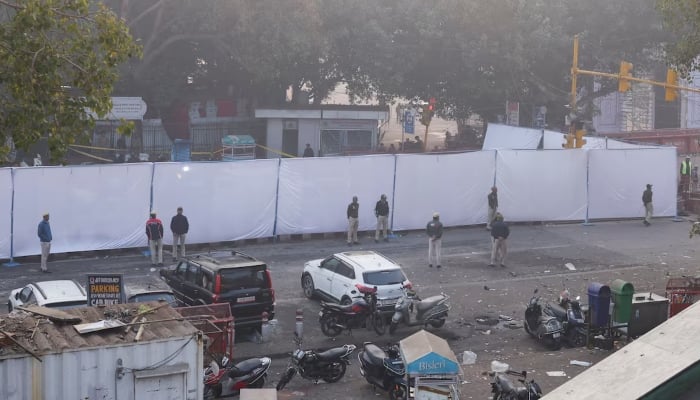 Police officers stand at the site of an explosion near the historic Red Fort in the old quarters of Delhi, India, November 11, 2025. — Reuters
