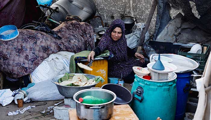 A Palestinian prepares food, amid a ceasefire between Israel and Hamas, in Jabalia, northern Gaza Strip, November 6, 2025. — Reuters
