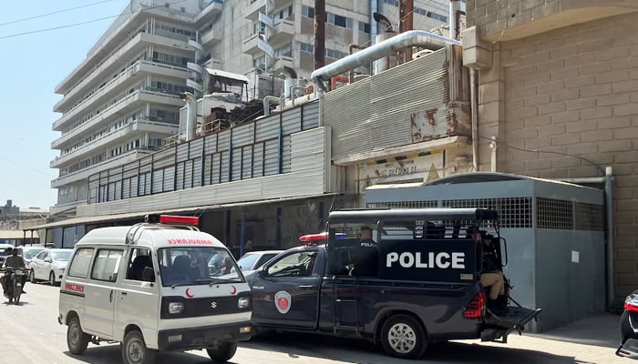 A view of police mobile and an ambulance outside a factory in Karachi, on November 5, 2024. — Reuters
